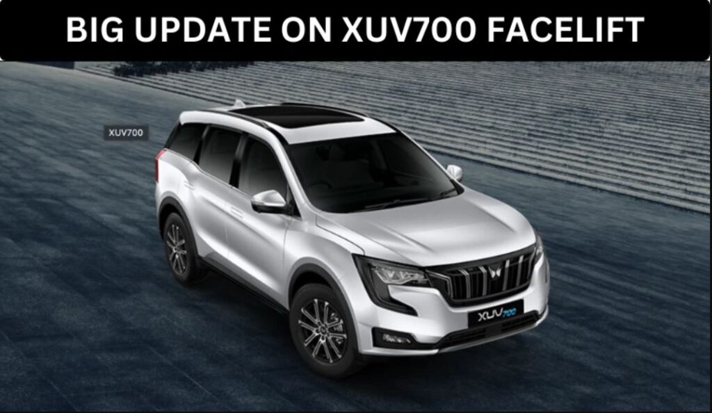 Mahindra XUV700 facelift model in silver, parked on a modern blue-tiled platform with text "BIG UPDATE ON XUV700 FACELIFT".